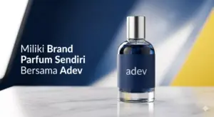 Botol parfum mewah adev dengan label biru navy dan kuning, latar belakang studio putih bersih elegan
